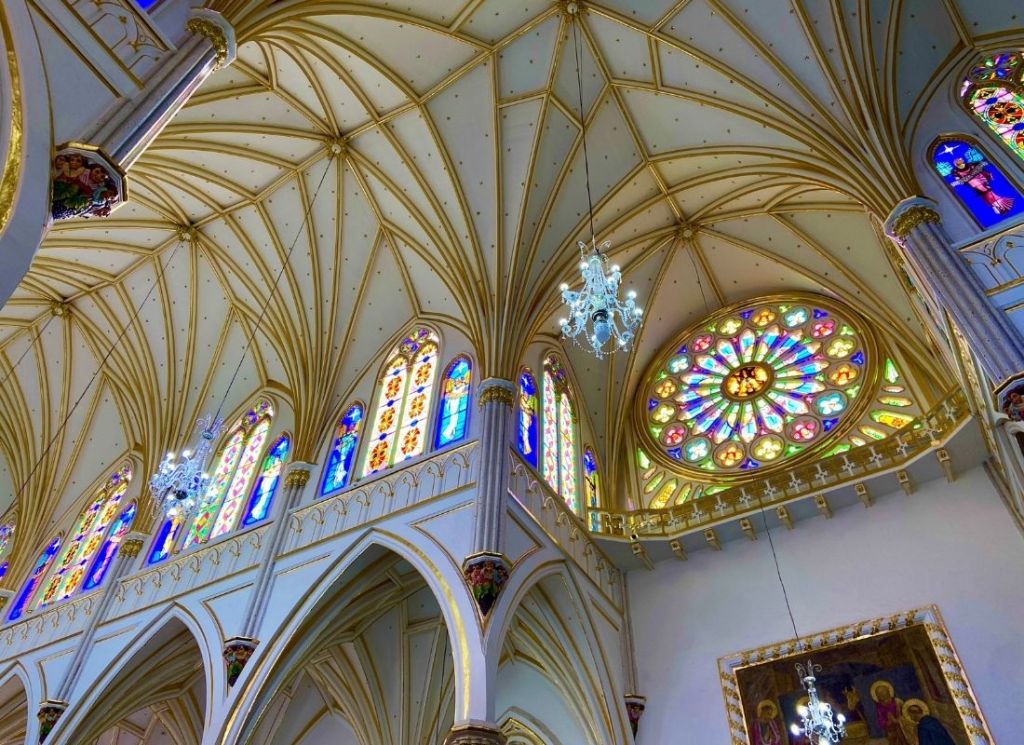 The stained-glass windows and the vaulted ceilings give the church an ethereal glow.