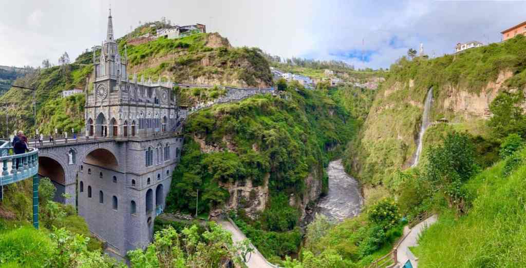Las Lajas Sanctuary in Colombia, built into the wall of a river canyon with a waterfall nearby, looks like a real-life Rivendell.
